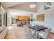 Inviting dining area open to the kitchen, offering a seamless flow and plenty of space for entertaining guests at 6054 S Akron Way, Greenwood Village, CO 80111