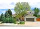 Charming single-Gathering home featuring a well-maintained front yard and an attached two-car garage at 6054 S Akron Way, Greenwood Village, CO 80111