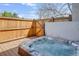 Outdoor hot tub with jets and privacy fencing, creating a perfect oasis for relaxation at 6054 S Akron Way, Greenwood Village, CO 80111