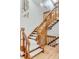 Elegant staircase with wooden banisters and carpeted steps, offering a grand entrance to the upper level at 6054 S Akron Way, Greenwood Village, CO 80111