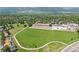 Expansive green field with walking path, near school and neighborhood, offering outdoor recreation and community engagement at 850 W Moorhead Cir # 3L, Boulder, CO 80305