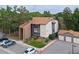 Exterior aerial showing a multi-unit building with landscaping, parking, and detached garages at 850 W Moorhead Cir # 3L, Boulder, CO 80305