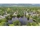 Picturesque lake with a fountain surrounded by mature trees and green spaces with mountain views in the background at 850 W Moorhead Cir # 3L, Boulder, CO 80305