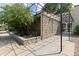 Exterior view of a stone building with a metal awning over a concrete path at 850 W Moorhead Cir # 3L, Boulder, CO 80305