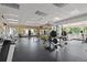 Spacious gym with weights and equipment, large windows, and dark flooring at 850 W Moorhead Cir # 3L, Boulder, CO 80305