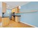 Efficient kitchen featuring stainless steel appliances, wooden cabinetry, and modern countertops at 850 W Moorhead Cir # 3L, Boulder, CO 80305