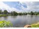 Beautiful lake view with clear skies, mature trees and calm waters, perfect for relaxation and enjoying nature's tranquility at 850 W Moorhead Cir # 3L, Boulder, CO 80305