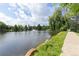 Scenic lake view with a serene path, mature trees and calming waters, great for relaxation and enjoying nature at 850 W Moorhead Cir # 3L, Boulder, CO 80305