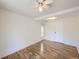 Open bedroom featuring light wood flooring, ceiling fan, and closet at 6047 S Hill St, Littleton, CO 80120