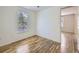 Bright bedroom featuring hardwood floors and a window at 6047 S Hill St, Littleton, CO 80120