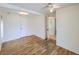 Open bedroom featuring light wood flooring, ceiling fan, and closet at 6047 S Hill St, Littleton, CO 80120