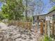 Charming home entrance featuring a decorative fence, stone walkway and a cozy entryway at 6047 S Hill St, Littleton, CO 80120