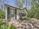Charming home entrance featuring a decorative fence, stone walkway and a cozy entryway at 6047 S Hill St, Littleton, CO 80120