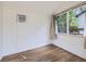 Small office featuring hardwood floors, a window, and an air conditioning unit at 6047 S Hill St, Littleton, CO 80120