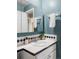Bathroom with a blue painted walls, white tile counters, and a white sink at 9290 Quitman St, Westminster, CO 80031