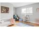 Bedroom featuring a daybed, comfortable chair, hopscotch rug, and natural light at 9290 Quitman St, Westminster, CO 80031