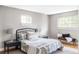 Well-lit bedroom with hardwood floors, neutral walls, and an iron bed frame at 9290 Quitman St, Westminster, CO 80031