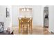 Bright dining area featuring wood table set, modern chandelier, and natural light at 9290 Quitman St, Westminster, CO 80031