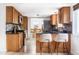 Stylish kitchen with updated cabinetry, granite countertops, and an open layout at 9290 Quitman St, Westminster, CO 80031