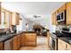 Modern kitchen with stainless steel appliances and stylish backsplash open to living area at 9290 Quitman St, Westminster, CO 80031