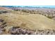 Aerial view of expansive land with mountain views in the background at 13682 W Virginia Dr, Lakewood, CO 80228