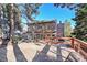 Elevated deck overlooking a wooded backyard at 13682 W Virginia Dr, Lakewood, CO 80228