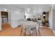 Modern dining area with a view into the living room at 13682 W Virginia Dr, Lakewood, CO 80228