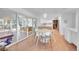 Bright dining area with sliding doors leading to a sunroom at 13682 W Virginia Dr, Lakewood, CO 80228