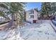 Modern home exterior with attached garage and driveway at 13682 W Virginia Dr, Lakewood, CO 80228