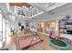 Spacious playroom with high ceilings, gymnastic equipment and a view of the kitchen at 13682 W Virginia Dr, Lakewood, CO 80228