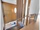 Mid-century modern staircase with wood and glass accents at 13682 W Virginia Dr, Lakewood, CO 80228