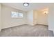 Spacious carpeted bedroom with neutral walls, a large window, and modern ceiling fan at 610 S Xenon Ct, Lakewood, CO 80228