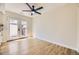 Open dining area with hardwood floors and a double glass patio door at 610 S Xenon Ct, Lakewood, CO 80228