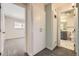 Hallway view showcasing built-in storage and doors to a bedroom and bathroom at 610 S Xenon Ct, Lakewood, CO 80228