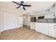 Open-concept kitchen and dining area featuring stainless steel appliances and ample cabinet space at 610 S Xenon Ct, Lakewood, CO 80228