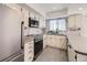 Modern kitchen with stainless steel appliances, ample counter space, and updated finishes at 610 S Xenon Ct, Lakewood, CO 80228