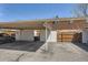 Carport parking with designated spaces next to brick home with fenced patio at 610 S Xenon Ct, Lakewood, CO 80228