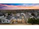 Aerial view of a well-maintained backyard with a wooden deck and mature landscaping in a residential neighborhood at 11825 Meadowood Ln, Parker, CO 80138
