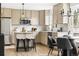 Modern kitchen features stainless steel appliances, marble countertops, and a stylish island with bar stool seating at 11825 Meadowood Ln, Parker, CO 80138