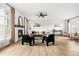 Stylish living room with a cozy fireplace, comfortable seating, and ample natural light from large windows at 11825 Meadowood Ln, Parker, CO 80138