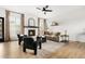 Inviting living room with a fireplace, modern decor, and plenty of natural light, perfect for relaxing at 11825 Meadowood Ln, Parker, CO 80138
