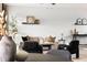 Inviting living room with stylish decor, neutral walls, and a comfortable sofa, perfect for relaxation and gatherings at 11825 Meadowood Ln, Parker, CO 80138