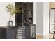 Chic storage cabinet in dining area with glass front hutch and gold handles on a decorative cabinet at 11825 Meadowood Ln, Parker, CO 80138