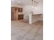 Stylish basement bar area featuring pendant lighting, countertop seating, and cabinetry at 4729 Twelve Oaks Way, Castle Rock, CO 80104