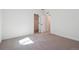 Bright bedroom with neutral carpet, closet and en-suite bathroom entrances at 4729 Twelve Oaks Way, Castle Rock, CO 80104