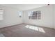 Bright, airy bedroom with large windows and carpet floors at 4729 Twelve Oaks Way, Castle Rock, CO 80104