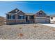 Charming two-story home with neutral color, well-maintained landscaping, and a welcoming front porch at 4729 Twelve Oaks Way, Castle Rock, CO 80104