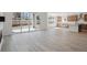 Spacious living area with patio doors open to the outside and connected to a modern kitchen at 4729 Twelve Oaks Way, Castle Rock, CO 80104