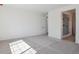 Bright bedroom with light colored walls, carpet floors, and ensuite bathroom at 4729 Twelve Oaks Way, Castle Rock, CO 80104