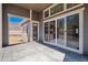 Covered patio with sliding glass doors leading to backyard and additional access door at 4729 Twelve Oaks Way, Castle Rock, CO 80104